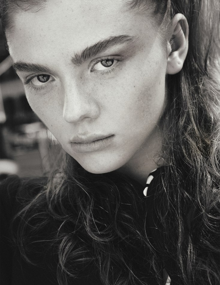 Black-and-white close portrait of Camryn