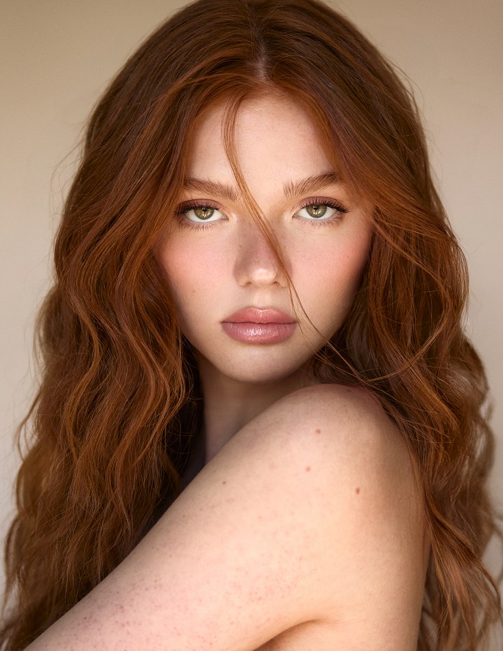 Close portrait of Camryn looking over her shoulder