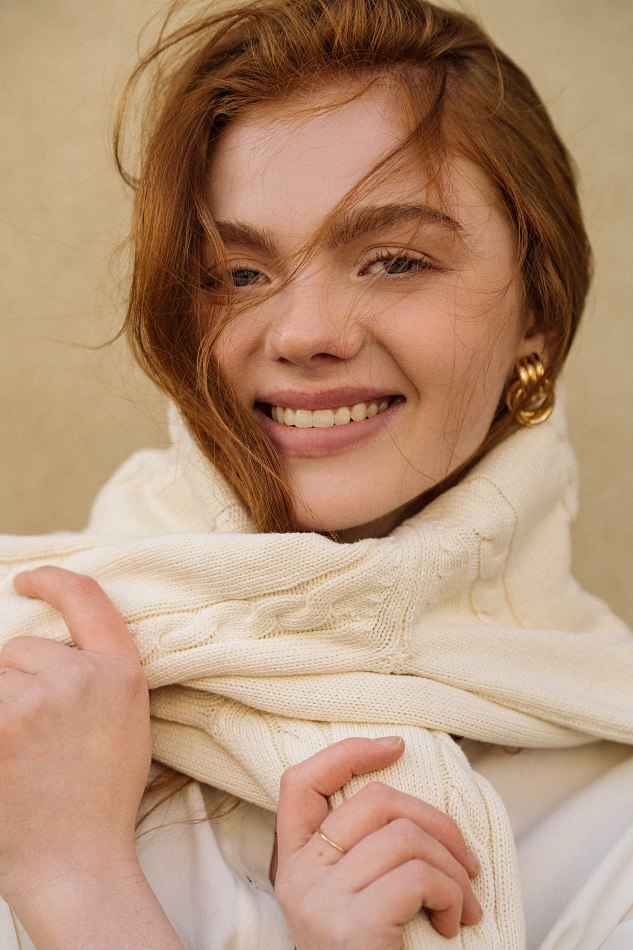 Natural portrait of Camryn wrapped in a cream scarf